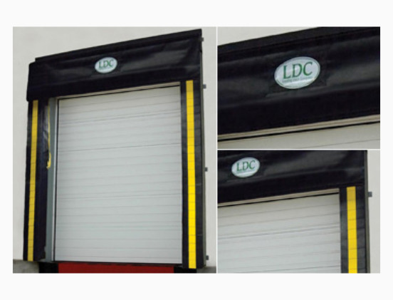White industrial roll-up door with black and yellow padded frame labeled LDC. Two close-up insets on the right show the LDC logo and dock seals and bumpers above the door.