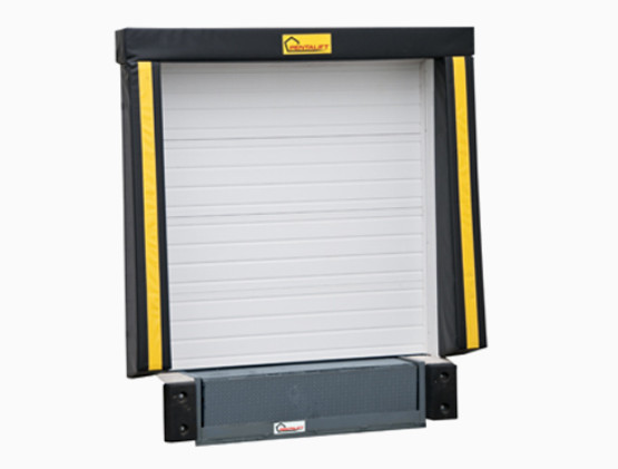 A closed white industrial loading dock door with a black and yellow protective bumper frame, dock seals and bumpers, and a gray dock leveler at the base.
